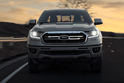 Front view of gray Ford Ranger with the headlamps turned on