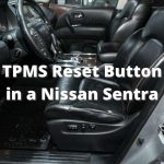 ¿Dónde está el botón de reinicio del TPMS en un Nissan Sentra?